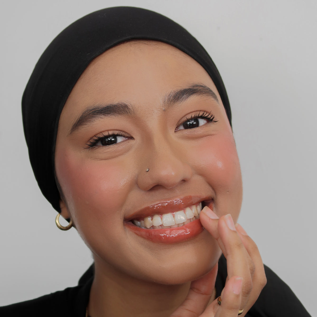 Peptide Glo Lip Oil in Maple Syrup worn on model (3 of 4)