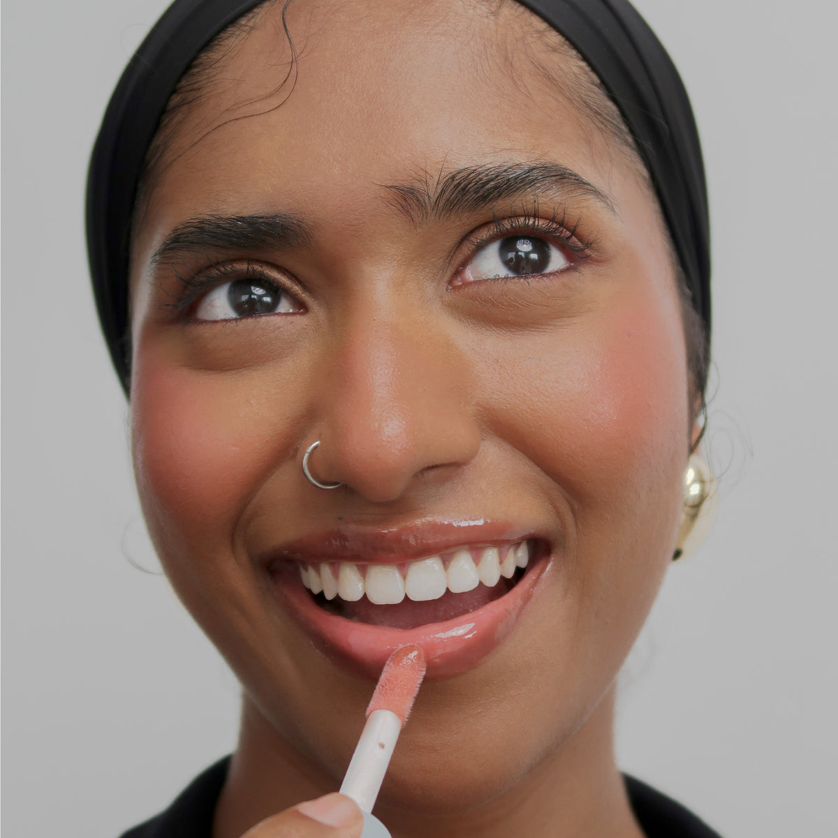 Peptide Glo Lip Oil in Maple Syrup worn on model (4 of 4)