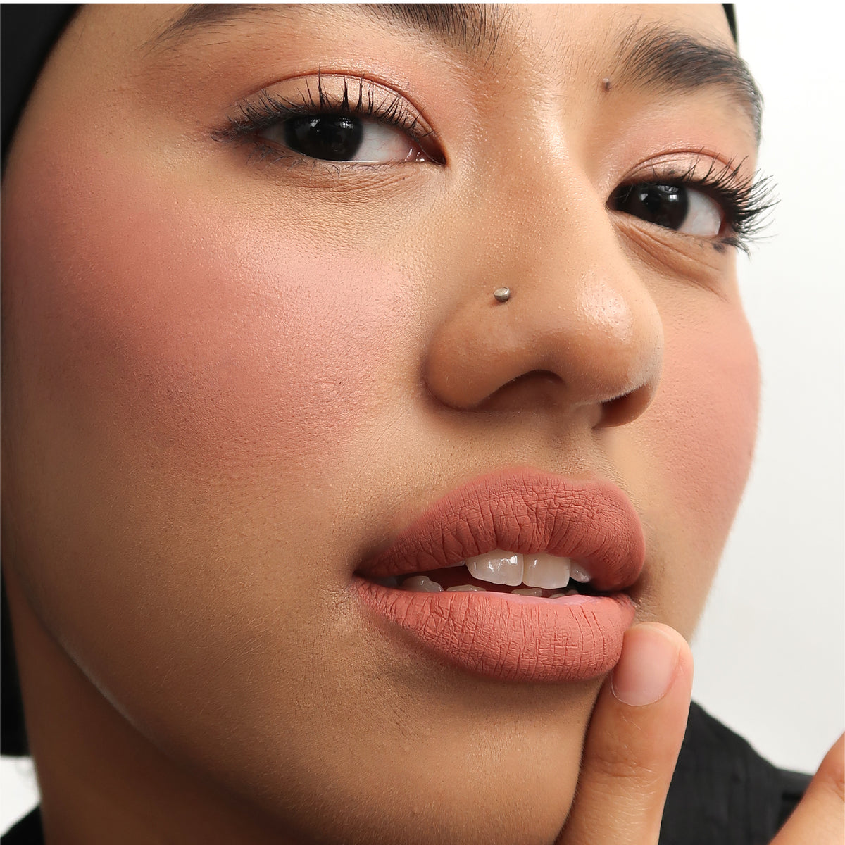 Peptide Hydra-Matte Lipstick in Got Lucky on medium skin