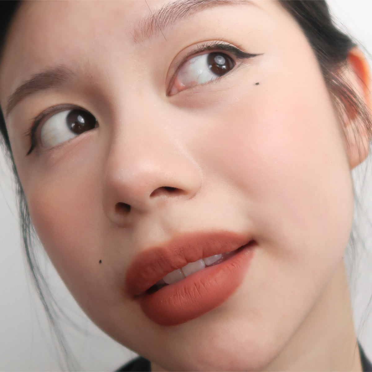 Peptide Hydra-Matte Lipstick in Homegirl on fair skin