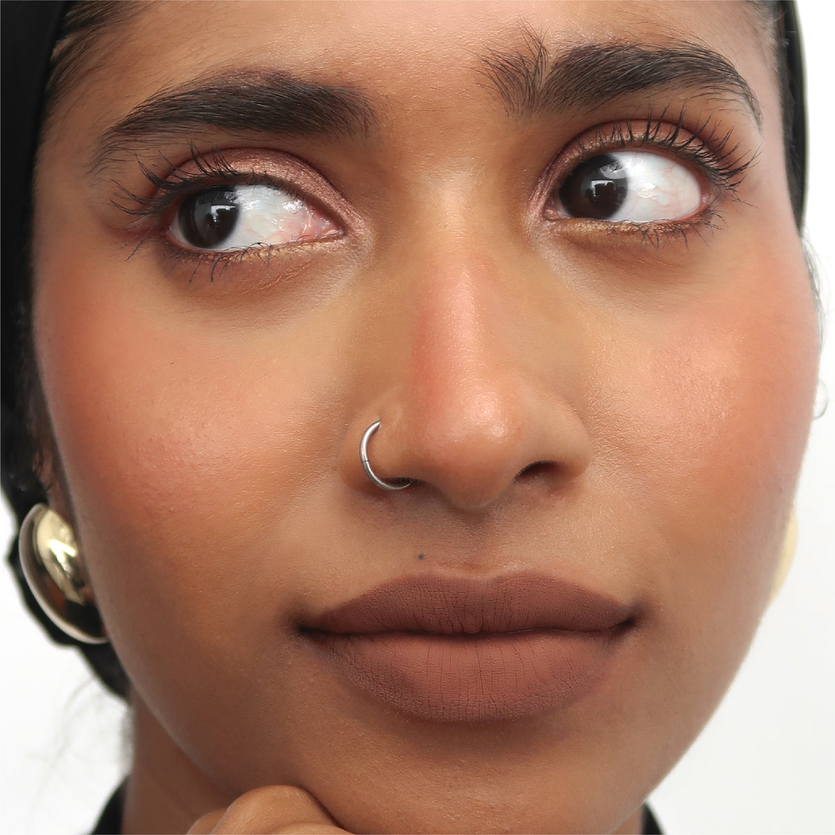 Peptide Hydra-Matte Lipstick in Homegirl on tan skin