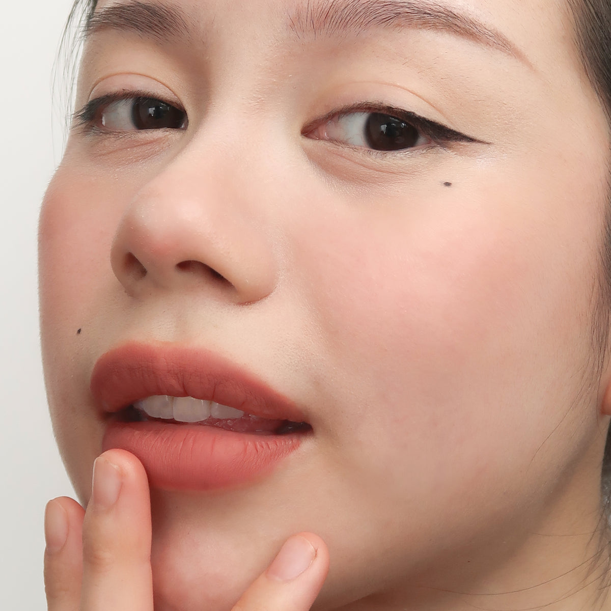 Peptide Hydra-Matte Lipstick in Love Letter on fair skin