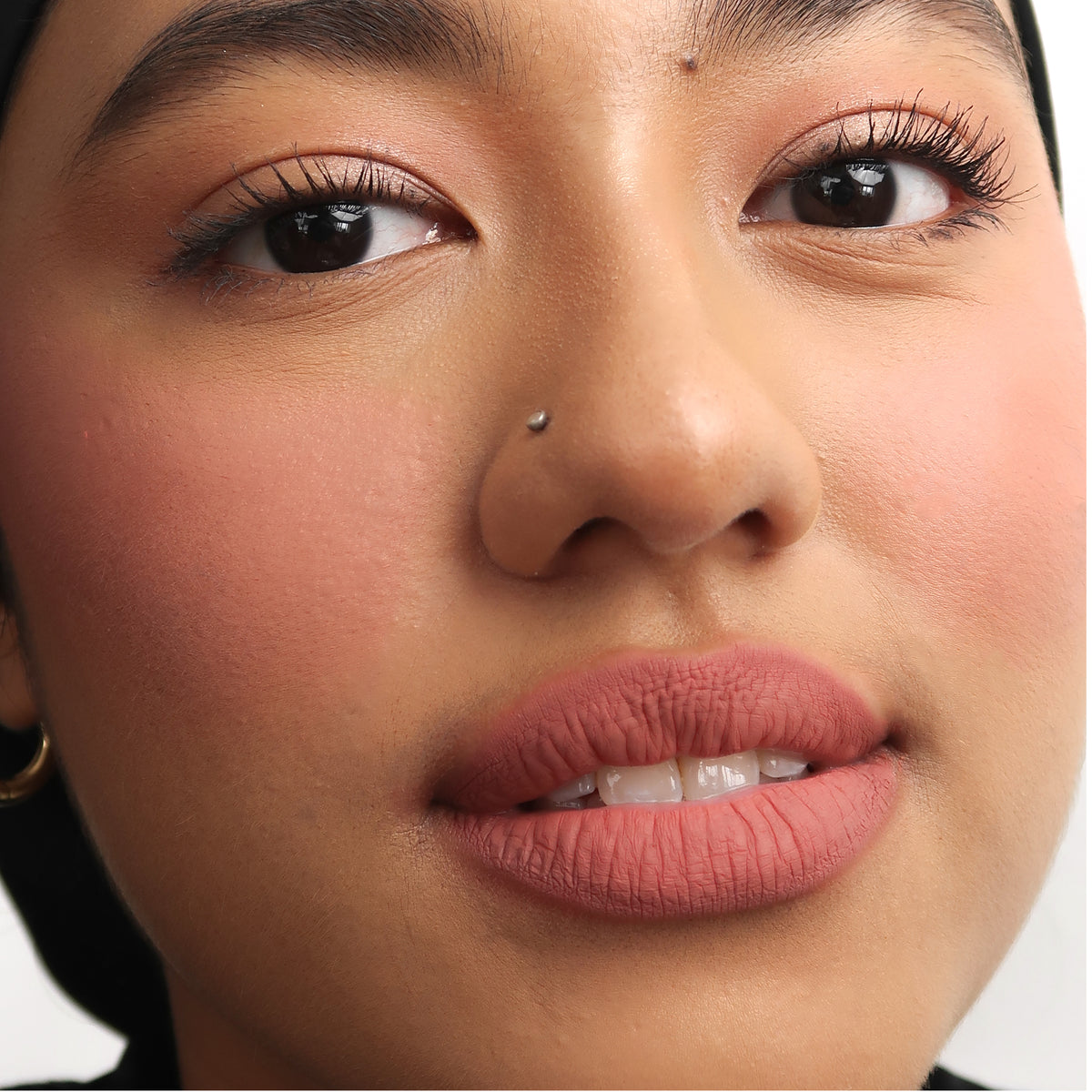 Peptide Hydra-Matte Lipstick in Love Letter on medium skin
