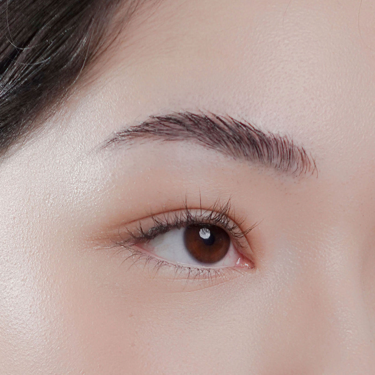 Soft Trace Brow Pencil in Smokey Grey on fair skin
