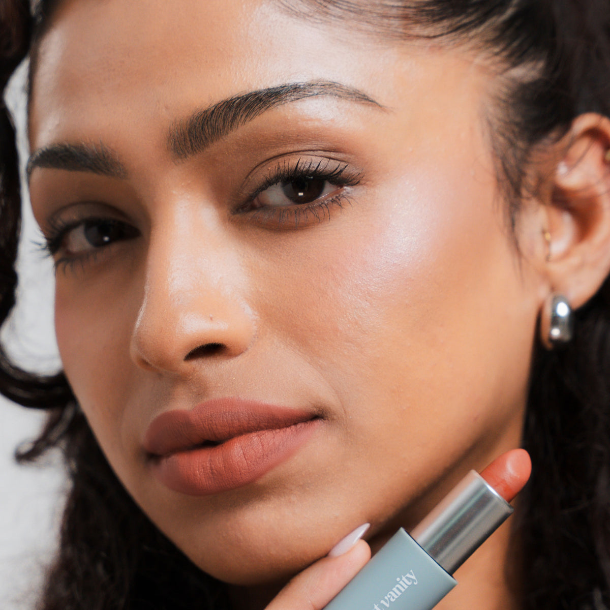 Soft Blur Glide-On Lipstick in Biscotti on tan skin