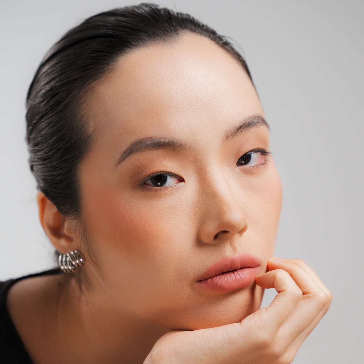 Soft Blur Glide-On Lipstick in Bloom on fair skin