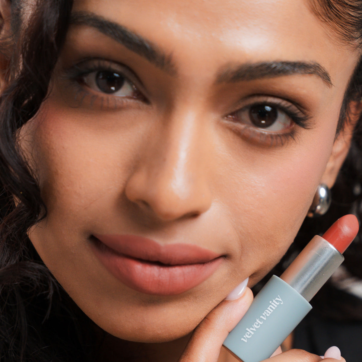 Soft Blur Glide-On Lipstick in Lucky on tan skin