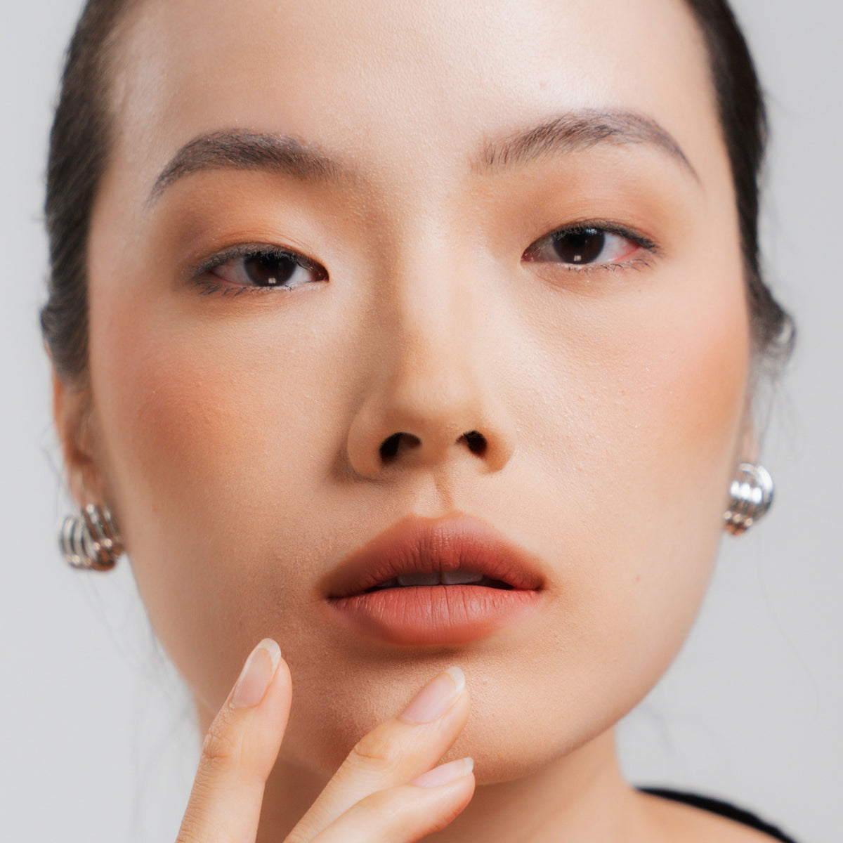 Soft Blur Glide-On Lipstick in Marsala on fair skin